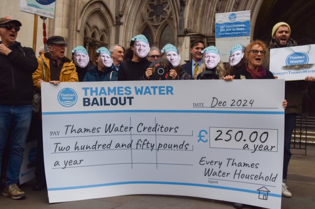 Mandatory Credit: Photo by Vuk Valcic/SOPA Images/Shutterstock (15012162d) Protesters wearing masks of UK Prime Minister Keir Starmer and Environment Secretary Steve Reed hold a giant 'Thames Water Bailout' mock cheque during the demonstration. Campaigners gathered outside the Royal Courts of Justice urging the court to block the Thames Water application for a 3 billion pound bailout, which the campaigners say would cost each household 250 pounds annually. Thames Water bailout hearing at the Royal Courts of Justice, London, UK - 17 Dec 2024