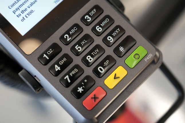TARLETON, UNITED KINGDOM - JULY 22: A contactless chip and pin terminal at the checkout at the new Tarleton Aldi store on July 22, 2022 in Tarleton, United Kingdom. Aldi is the UK???s fifth largest supermarket chain and has 950 stores. The new Aldi store is the first in the Preston area. (Photo by Christopher Furlong/Getty Images)