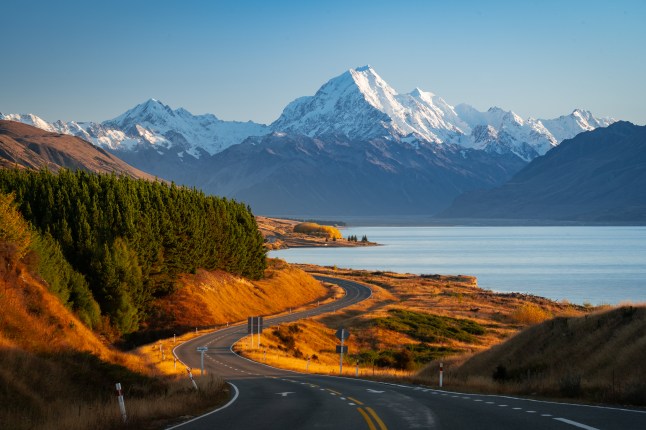 A mountain topped with snow beside a lake in New Zealand