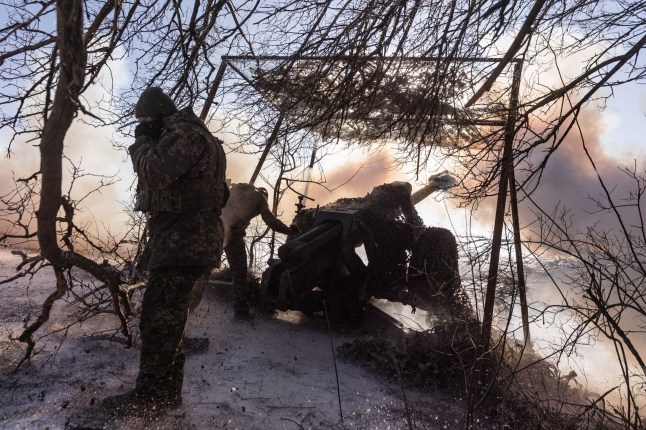 DONETSK OBLAST, UKRAINE - FEBRUARY 17: Ukrainian soldiers of the 117th Brigade fire D-30 artillery in the direction of Pokrovsk, Ukraine on 17 February 2025. (Photo by Diego Herrera Carcedo/Anadolu via Getty Images)