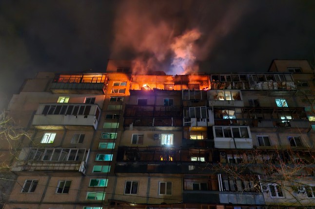 KYIV, UKRAINE - MARCH 23: Upper floors of a 9-story residential building in the Dniprovskyi district are damaged by a Russian drone strike - a fire broke out in apartments on March 23, 2025 in Kyiv, Ukraine. In the early morning, the Russian army attacked Kyiv and Oblast with Shahed-type drones, most of which were intercepted by Ukraine's Air Defense Forces. However, the fragments of some drones damaged residential high-rise buildings, an office building, and vehicles in at least five districts of the city. At least 8 people were injured; and three were killed, including a 5-year-old child. (Photo by Roman Petushkov/Global Images Ukraine via Getty Images)