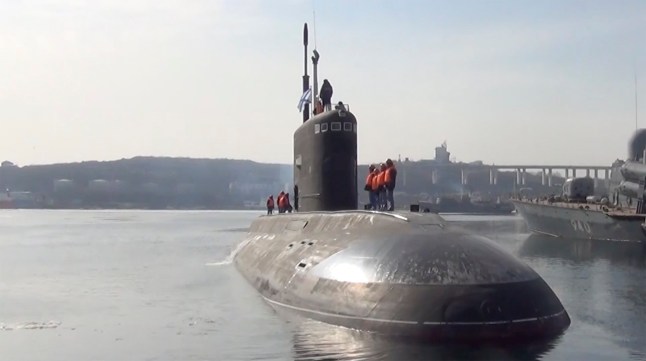 Vladimir Putin staged war games in a warning to the West as his Pacific Fleet submarine Ufa launched Kalibr cruise missiles during exercises in the Sea of Japan.