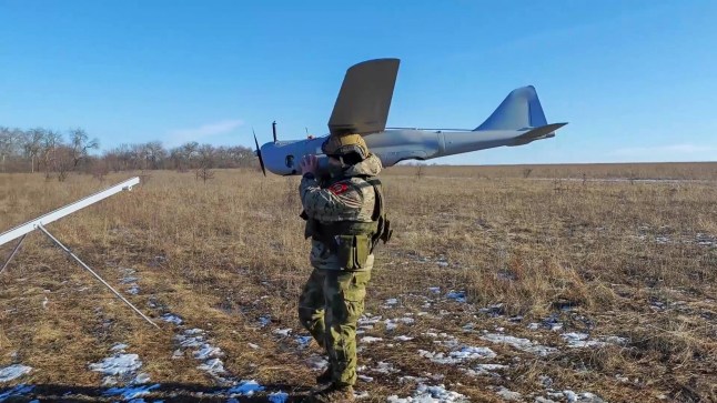 SEREBRYANSKY, RUSSIA - FEBRUARY 16: (----EDITORIAL USE ONLY MANDATORY CREDIT - 'RUSSIAN DEFENSE MINISTRY / HANDOUT' - NO MARKETING NO ADVERTISING CAMPAIGNS - DISTRIBUTED AS A SERVICE TO CLIENTS----) A screen grab captured from a video shows the Tsentr Group of Forces 152-mm 2S5 Giatsint-S platoon along with an Orlan-10 unmanned aerial vehicle team wipe out an AFU unmanned aerial vehicle command post near Serebryansky forestry in Krasnyi Lyman direction, of the special military operation zone, Serebryansky, Russia on February 16, 2024. S-8 rockets were launched at the closest range under severe weather conditions. AFU unmanned aerial vehicle command post near Serebryansky forestry in Krasny Lyman direction of the special military operation zone. In the course of a mission, the Orlan-10 drone team located movement of Ukrainian troops between a forest belt and a lonely house. According to intelligence gathered by the Group's reconnaissance units, an AFU unit unmanned aerial vehicle command post was located in that area. After additional intelligence gathering efforts in the area, the unmanned aerial vehicle team transmitted the coordinates to the artillery command post. With real-time firing adjustment, the Central MD's self-propelled artillery regiment artillery crew struck the located target with several shots from a distance of about 20 kilometres. The drone camera recorded a direct hit and smoke. The activity of Ukrainian nationalists' aerial reconnaissance means were significantly reduced after the strike. (Photo by Russian Defense Ministry / Handout/Anadolu via Getty Images)