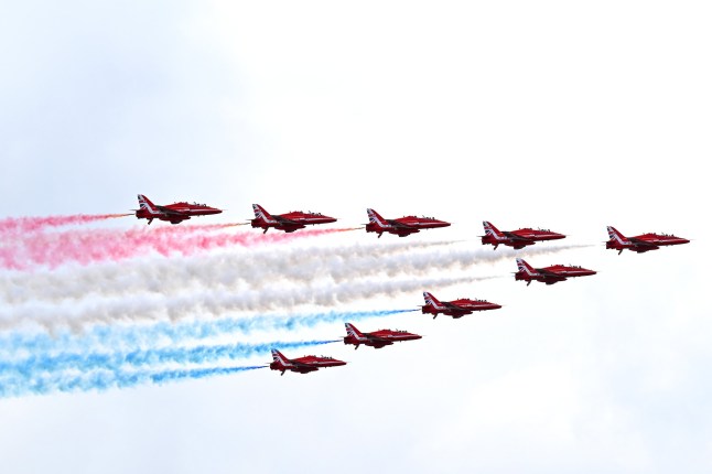 NORTHAMPTON, ENGLAND - JULY 07: The RAF Red Arrows perform a fly past over the grid prior to the F1 Grand Prix of Great Britain at Silverstone Circuit on July 07, 2024 in Northampton, England. (Photo by James Sutton - Formula 1/Formula 1 via Getty Images)