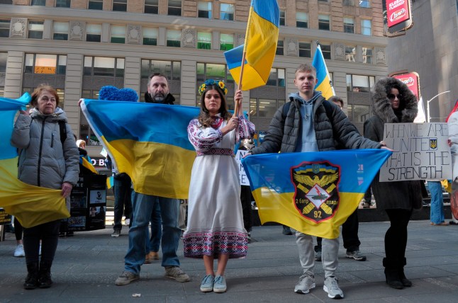 Mandatory Credit: Photo by Jimin Kim/SOPA Images/Shutterstock (15186955h) Pro-Ukraine demonstrators hold Ukrainian flags at a rally in Times Square. Demonstrators supporting Ukraine rallied in Manhattan, New York City. Protestors condemned the Russian invasion of Ukraine and Russian President Vladimir Putin. The rally took place days after a public verbal clash between US President Donald Trump and Ukrainian President Volodymyr Zelenskyy regarding a Ukraine and Russia ceasefire deal. Trump is pushing to broker the ceasefire deal, which would include the US accessing Ukraine's mineral deposits. Ukraine Rally in New York City, US - 09 Mar 2025