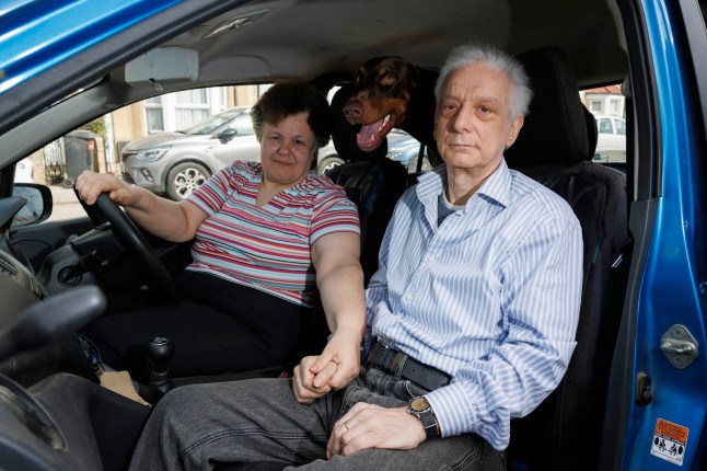 A man and his wife with a parking ticket they got from Euro Car Parks in Enfield.