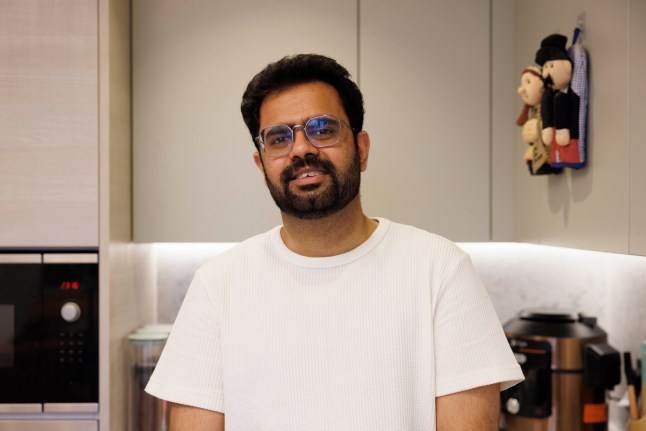 What I Own - Poplar. Nitish Kumar. Pictured: Nitish in the kitchen. Image shot on 4th April 2025. ?? Belinda Jiao jiao.bilin@gmail.com 07598931257 https://www.belindajiao.com/about
