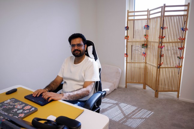What I Own - Poplar. Nitish Kumar. Pictured: Nitish in the guest bedroom/ office. Image shot on 4th April 2025. ?? Belinda Jiao jiao.bilin@gmail.com 07598931257 https://www.belindajiao.com/about