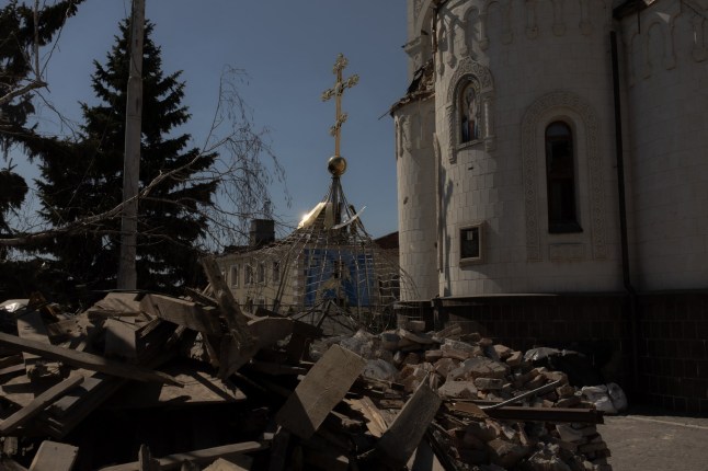 This photograph shows a dome lying next to a church heavily damaged by shelling in Kostyantynivka, eastern Donetsk region, on April 18, 2025, amid the Russian invasion of Ukraine. (Photo by Roman PILIPEY / AFP) (Photo by ROMAN PILIPEY/AFP via Getty Images)
