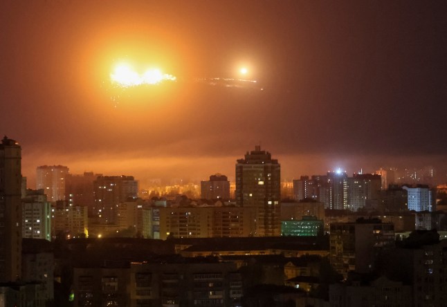 A ballistic missile explodes in the sky over the city during a Russian drone strike, amid Russia's attack on Ukraine, in Kyiv, Ukraine April 24, 2025. REUTERS/Gleb Garanich