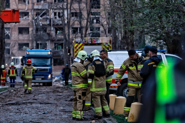 KYIV, UKRAINE - APRIL 24: Rescue workers respond at the site of a Russian missile strike on apartment residential buildings in Svyatoshynskyi district on April 24, 2025 in Kyiv, Ukraine. In the early morning, Russia has launched a mass combined attack on the Ukrainian capital, and other cities of Ukraine. The strike on Kyiv resulted in the destruction of multi-story residential buildings, damage to administrative buildings, and non-residential buildings. At least ten people were killed and 63 were injured, including six children. Rescue workers continue to search for people under the rubble. (Photo by Yan Dobronosov/Global Images Ukraine via Getty Images)