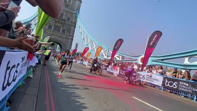Handout screen grab issued by Youth Demand of their protest during the TCS London Marathon on Tower Bridge, London. The group, which is calling for a trade embargo on Israel, said two of its supporters jumped over the barriers and threw red powered paint in front of the men's elite race at around 10.35am. Issue date: Sunday April 27, 2025. PA Photo. See PA story CHARITY Marathon. Photo credit should read: Youth Demand/PA Wire NOTE TO EDITORS: This handout photo may only be used for editorial reporting purposes for the contemporaneous illustration of events, things or the people in the image or facts mentioned in the caption. Reuse of the picture may require further permission from the copyright holder.